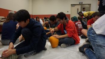 Members focusing on their carving skills!