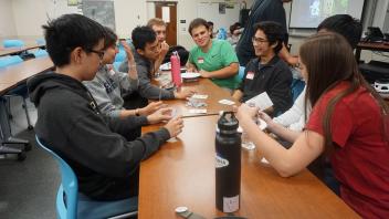 Members focusing intently on a game